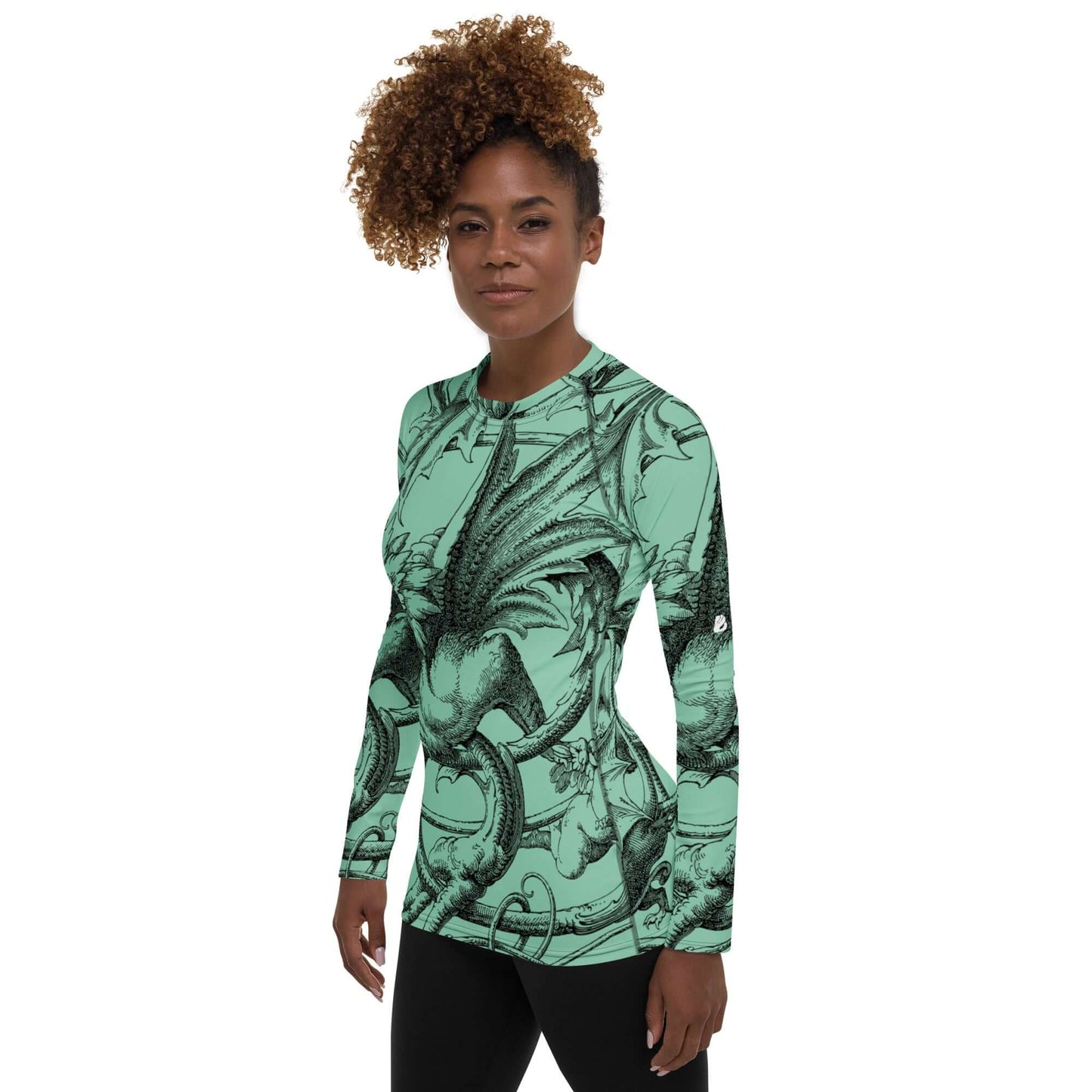 Woman wearing Damen-Rash-Guard N°9 with dragon design, long sleeves, and UV protection, suitable for sports in green and black colors.