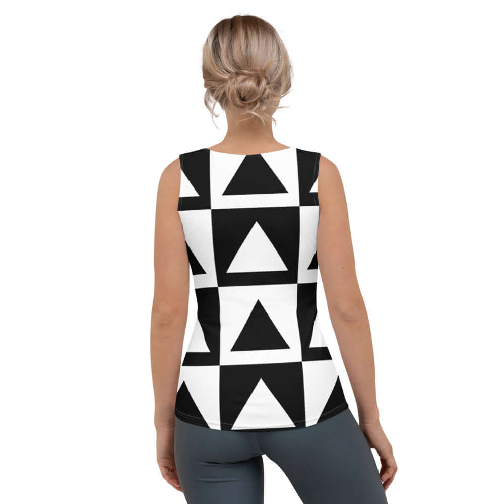 Back view of a woman wearing a black and white geometric design Sublimation-Cut-&-Sew-Tank-Top N°0, showcasing four-way stretch fabric.
