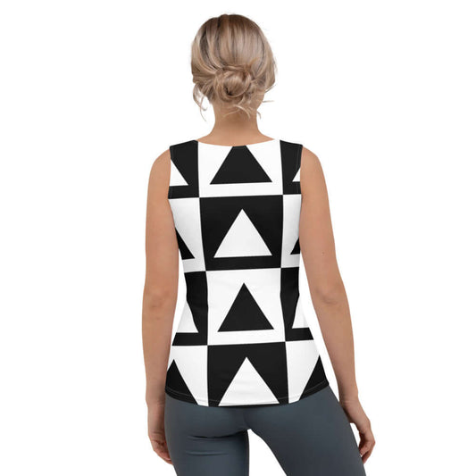 Back view of a woman wearing a black and white geometric design Sublimation-Cut-&-Sew-Tank-Top N°0, showcasing four-way stretch fabric.