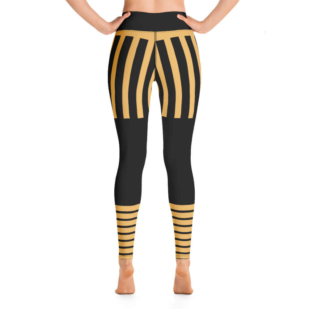 Rear view of Yoga-Leggings N°5 in black and gold stripe design, showcasing high-waisted four-way stretch fabric.