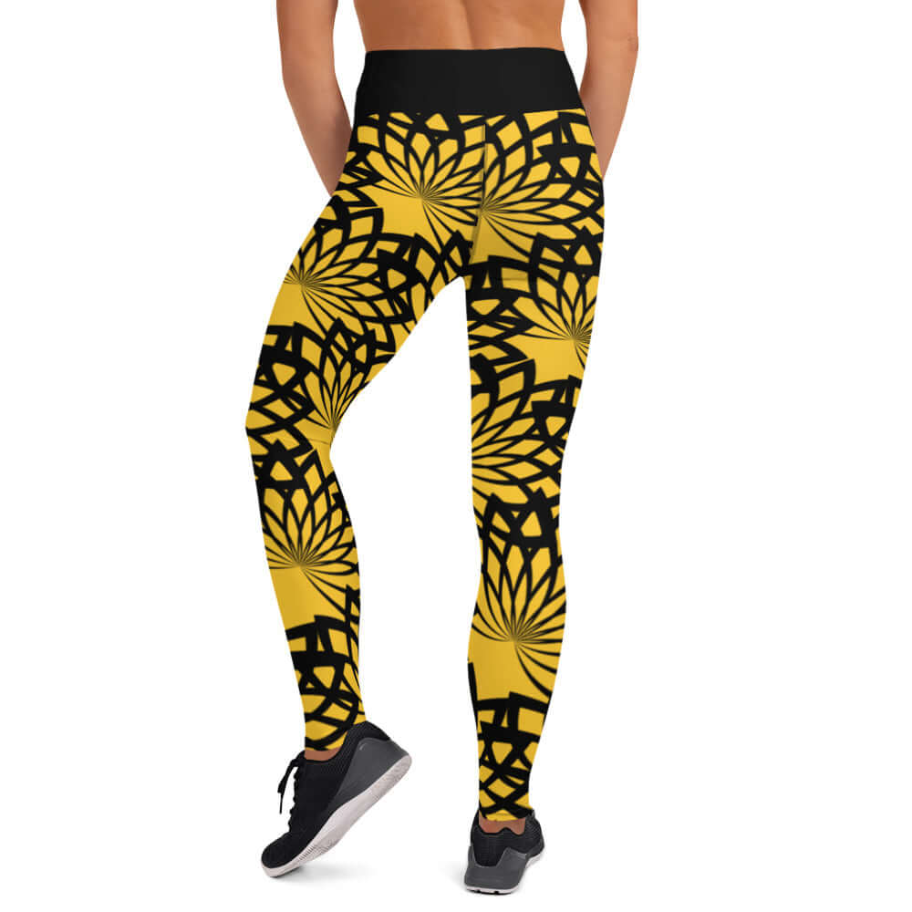 Person wearing Yoga-Leggings N°16 with yellow and black floral pattern, high waistband, showcasing comfortable fit from rear view.