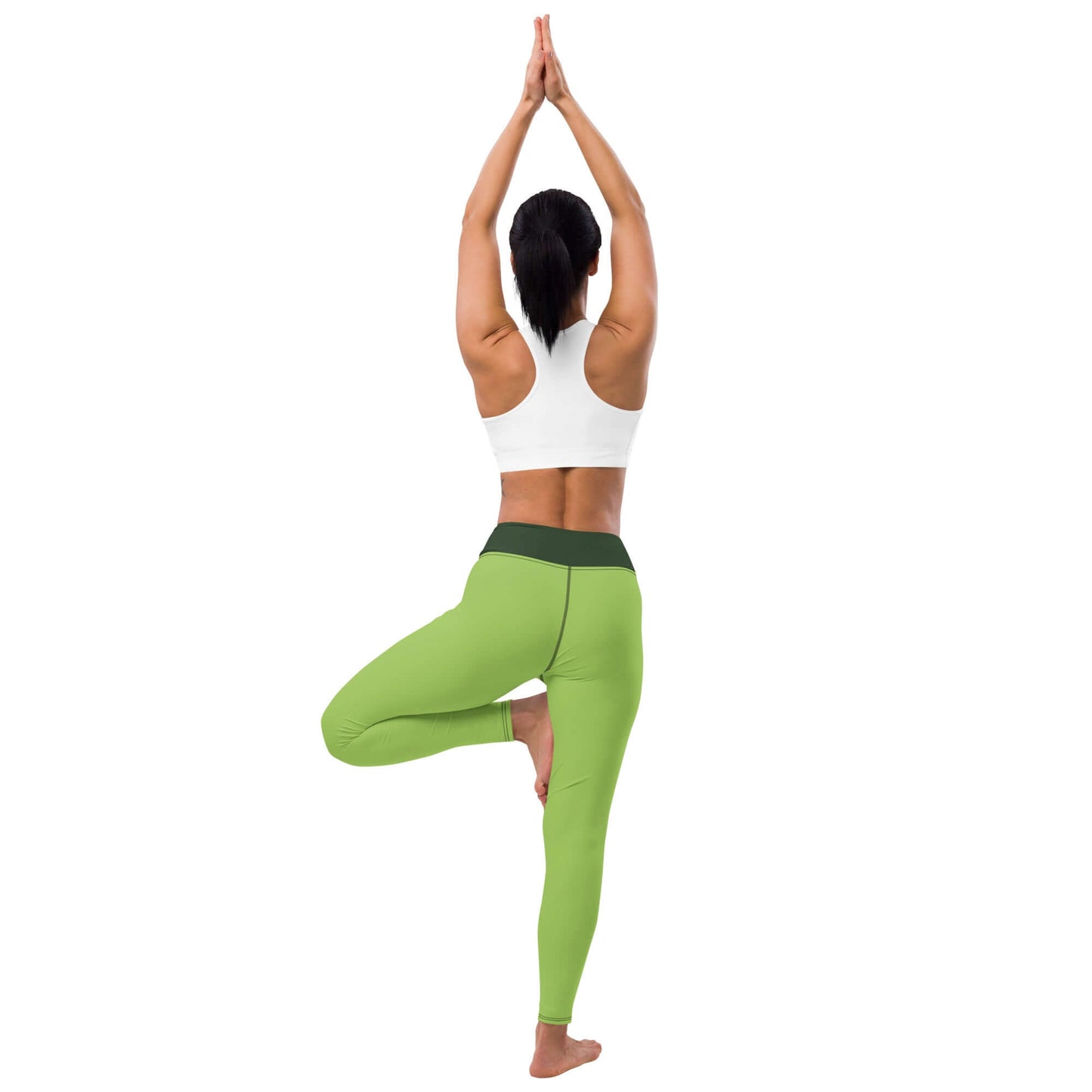 Woman practicing yoga in green Yoga-Leggings N°43, demonstrating comfortable stretch and flexibility in tree pose.
