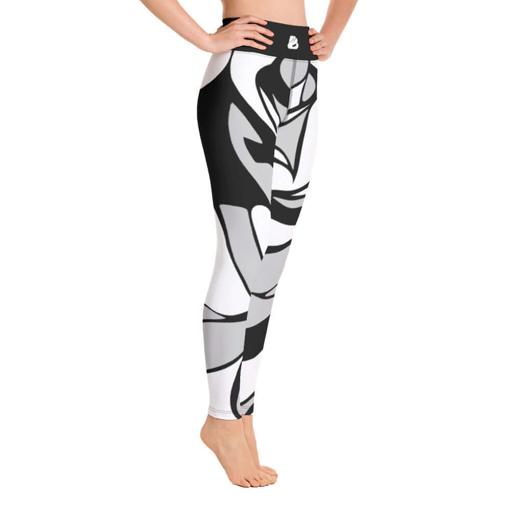 Woman wearing Yoga-Leggings N°21 with black and white abstract design, high waist, made from soft stretchy polyester-elastane fabric.