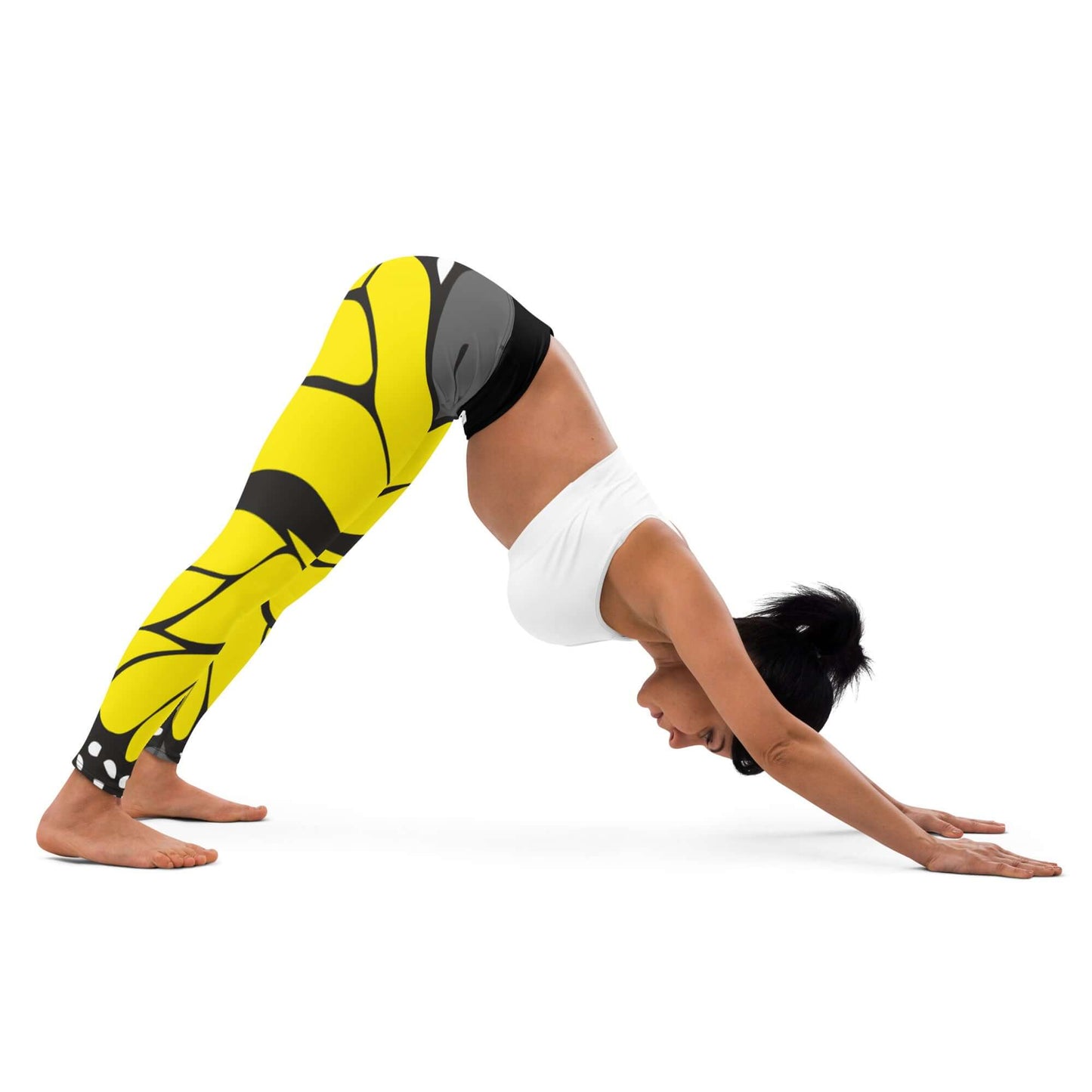 Woman in Downward Dog pose wearing Yoga-Leggings N°41 with yellow pattern, demonstrating four-way stretch flexibility in yoga practice.