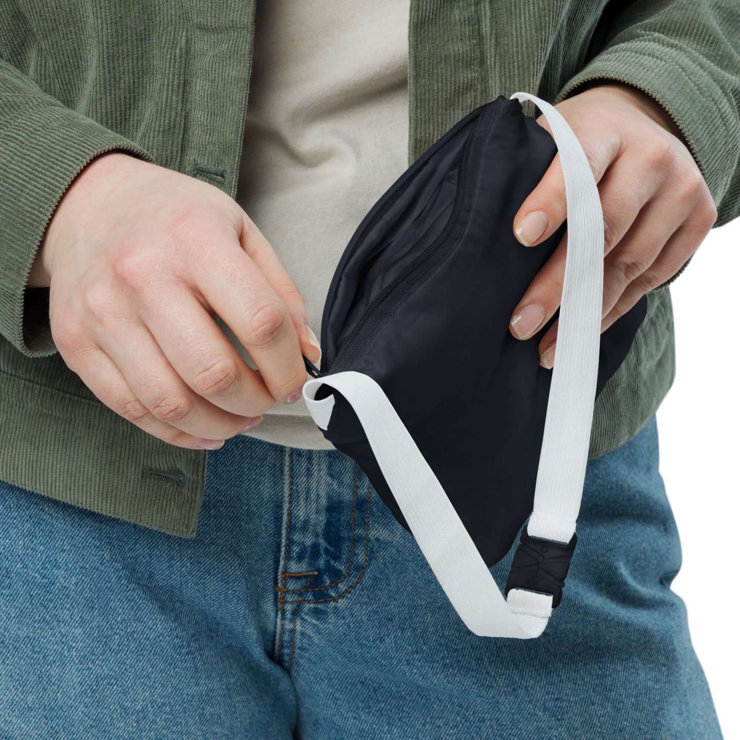 Person zipping a Basic-Unisex-Windbreaker N°0 for outdoor activities, highlighting its lightweight and durable design.
