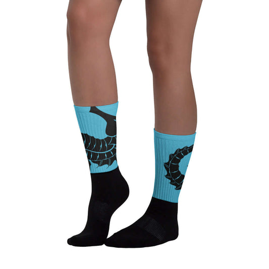 Person wearing Socken N°9 with bright colors and padded black foot.