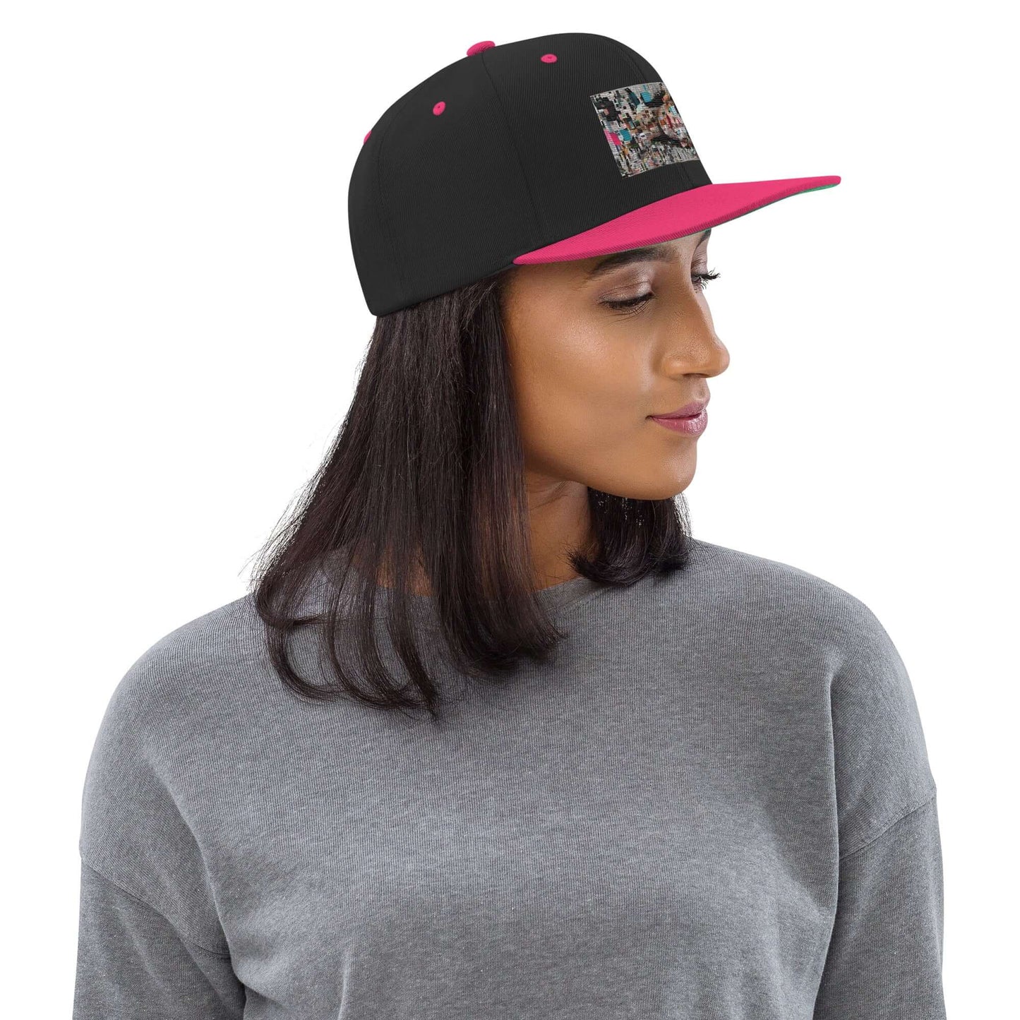 Woman wearing Snapback-Cap N°6 with black and pink design and adjustable snap closure, featuring structured 6-panel style.