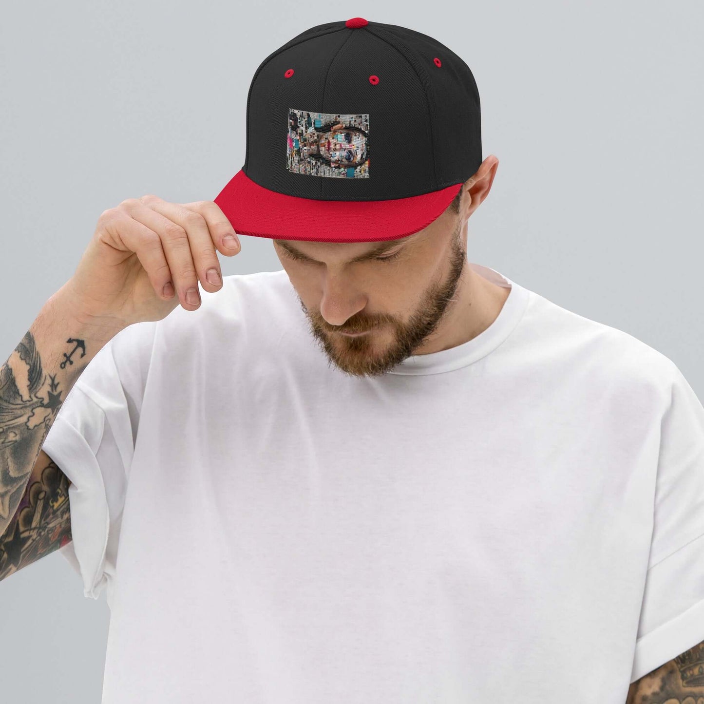 Man wearing Snapback-Cap N°6 with red visor, black crown, and unique design patch, showcasing classic fit with adjustable snap closure.