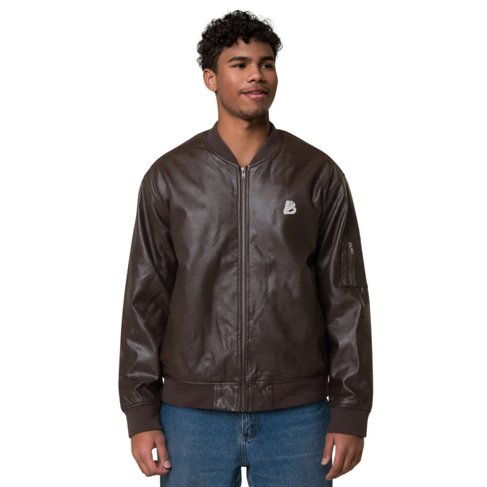 Man wearing Leder-Bomberjacke N°0 made of brown PU leather with embroidered back, showcasing a classic and stylish fit.