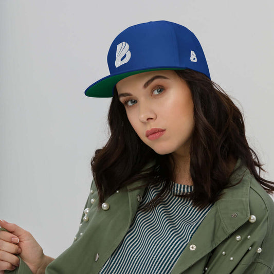 Woman wearing Flat Bill-Cap N°0 with green under visor, 100% cotton corduroy, snapback closure, stylish high-profile hat.