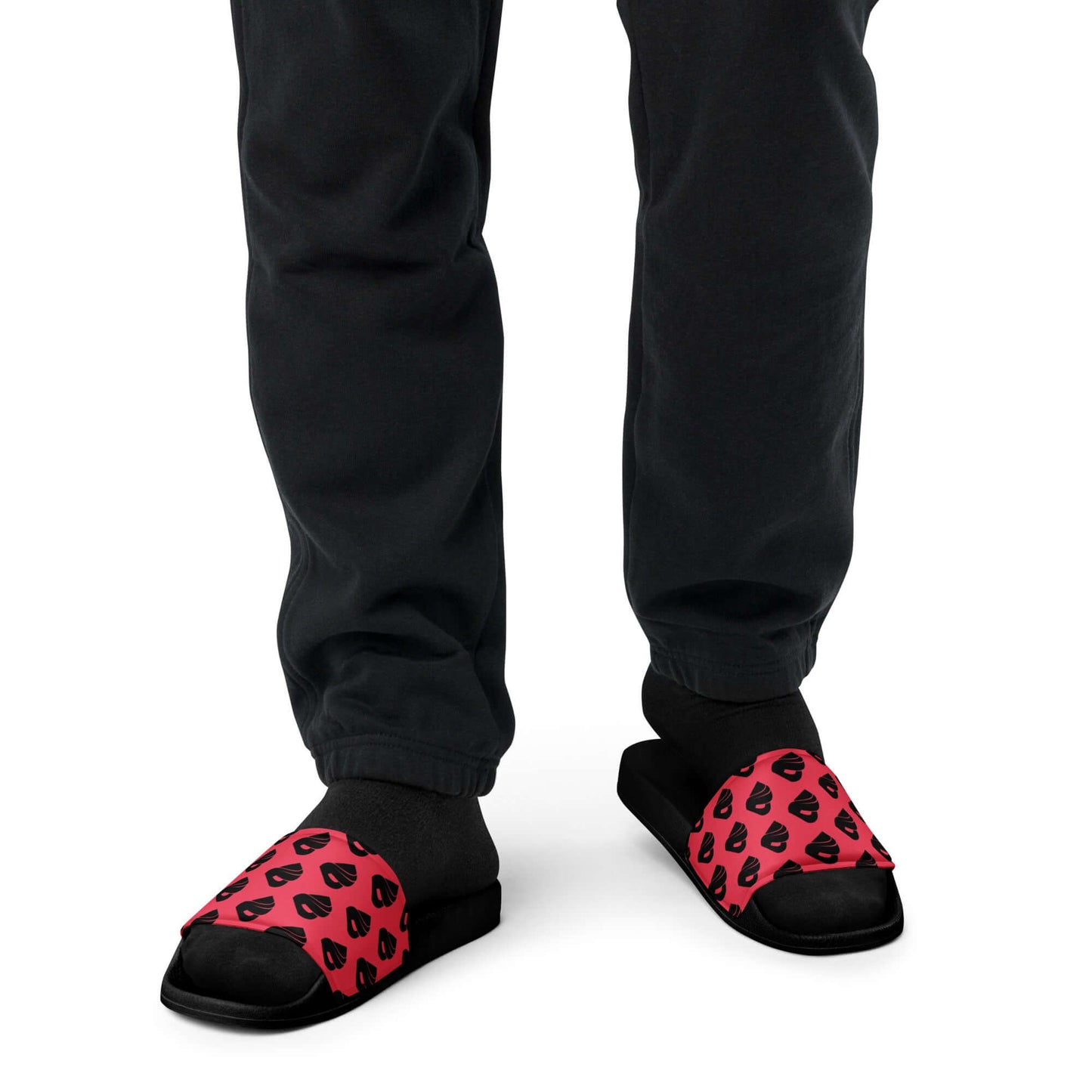 Person wearing Herren-Schlappen N°2 sandals with cushioned strap and contoured footbed, paired with black pants.