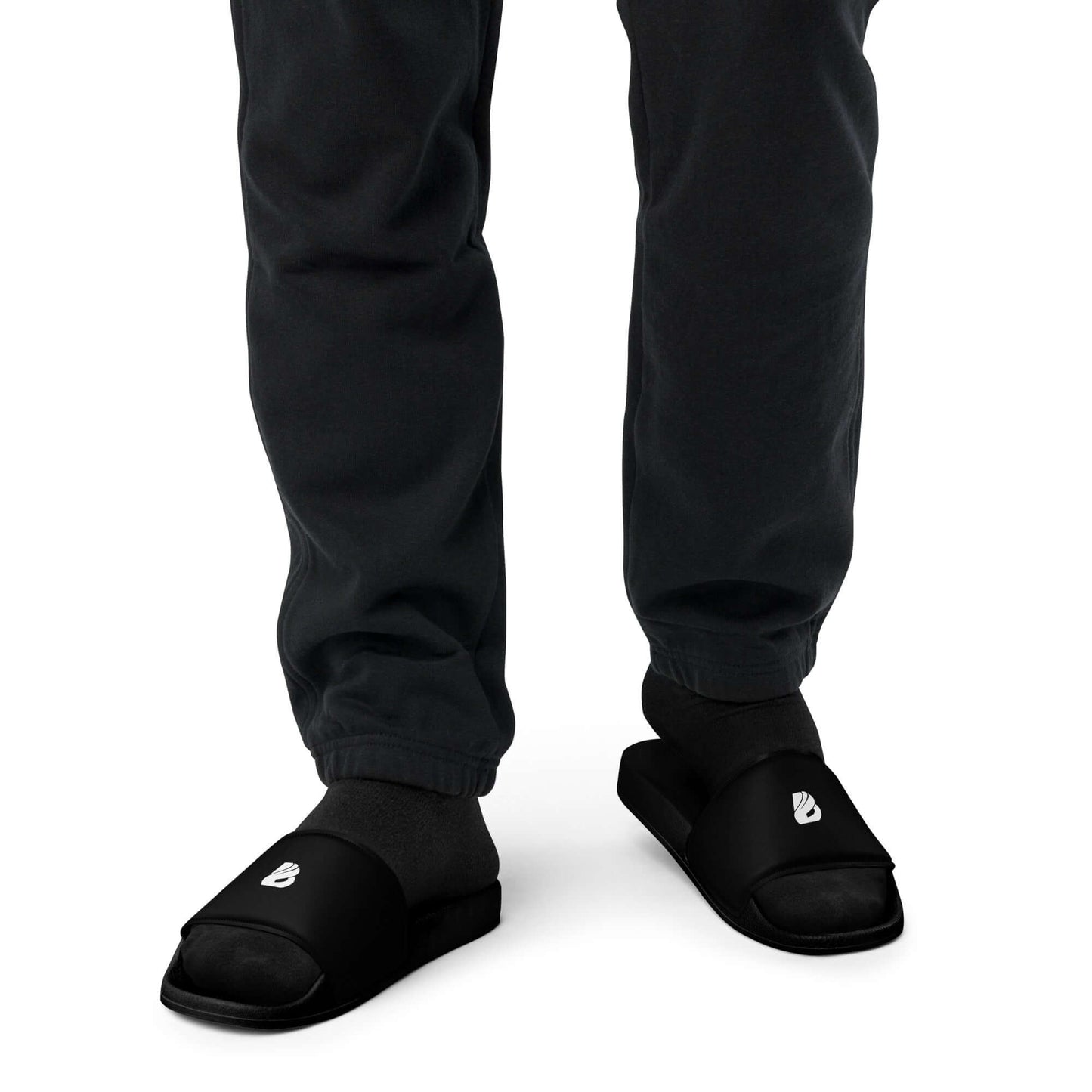 Person wearing Herren-Schlappen N°1 with padded strap and textured footbed, ideal for summer activities. Lightweight PU sole.