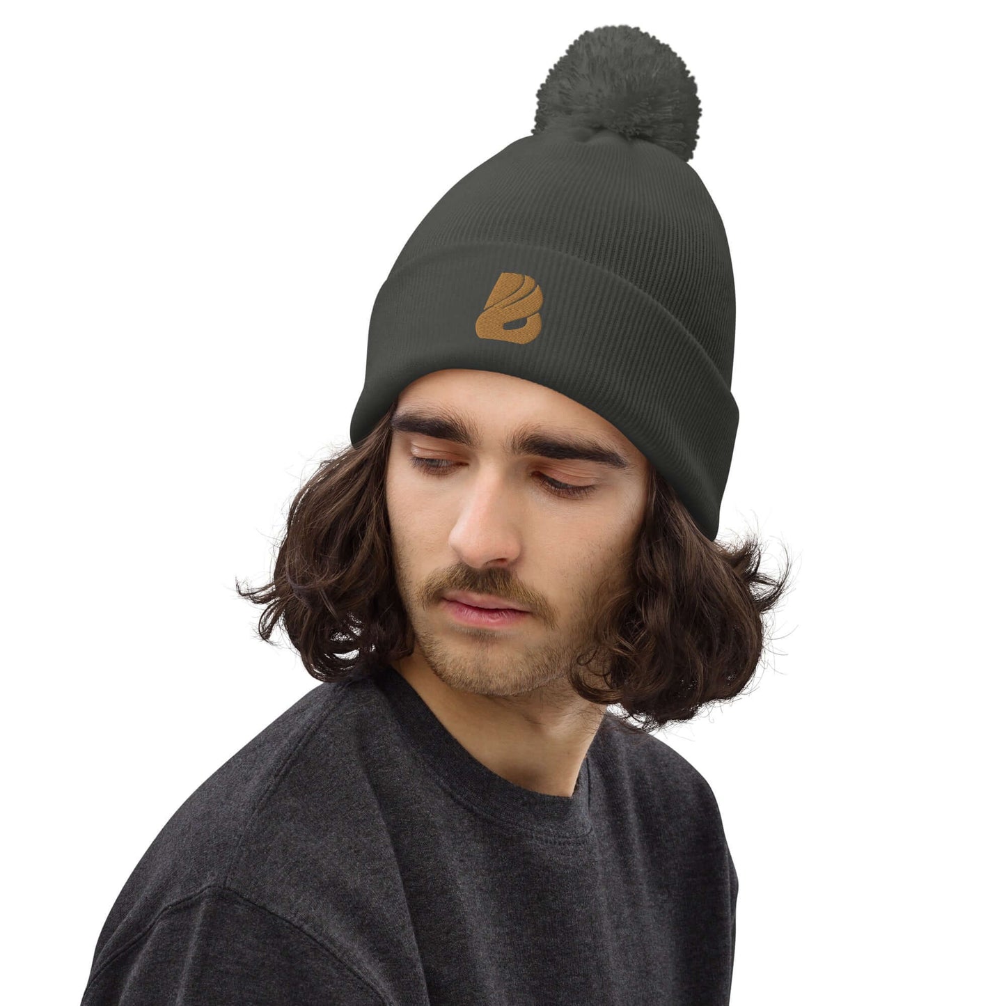 Bommel-Beanie N°0 on model, double-layered knit with matching pompom, made from soft 100% acrylic fiber, perfect for fall and winter.