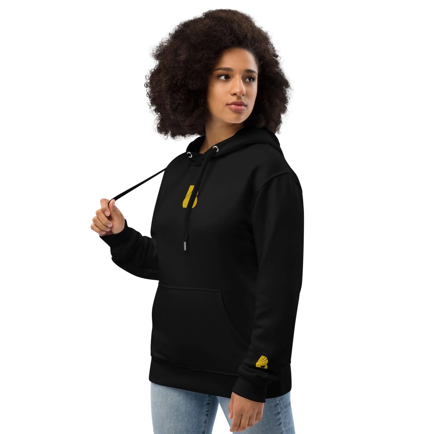 Model wearing Hochwertiger Öko Kapuzenpullover N°9 in black, made from organic cotton and recycled materials with front pocket and hood.