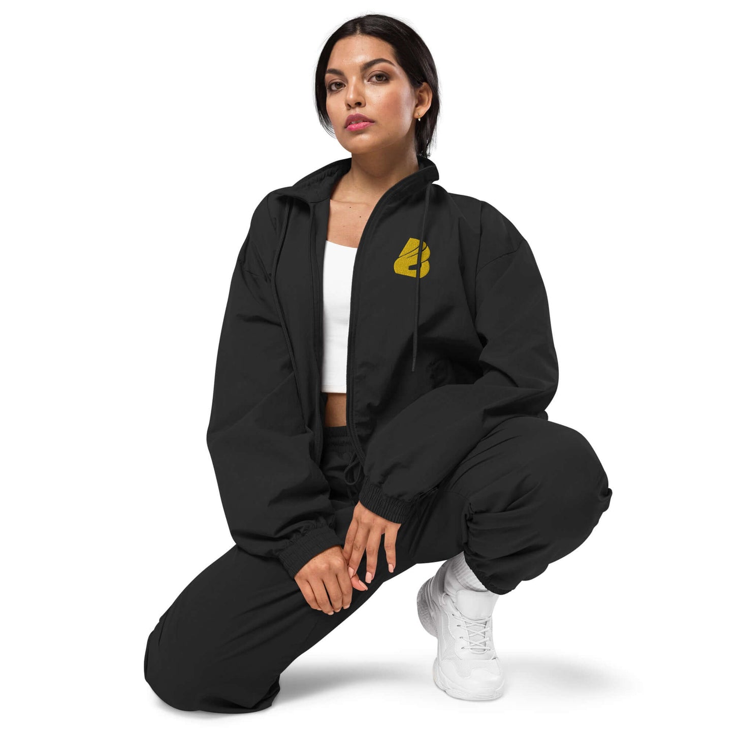 Woman wearing Recyclete Trainingsjacke N°1 styled with matching joggers and white sneakers, showcasing a modern and versatile outfit.