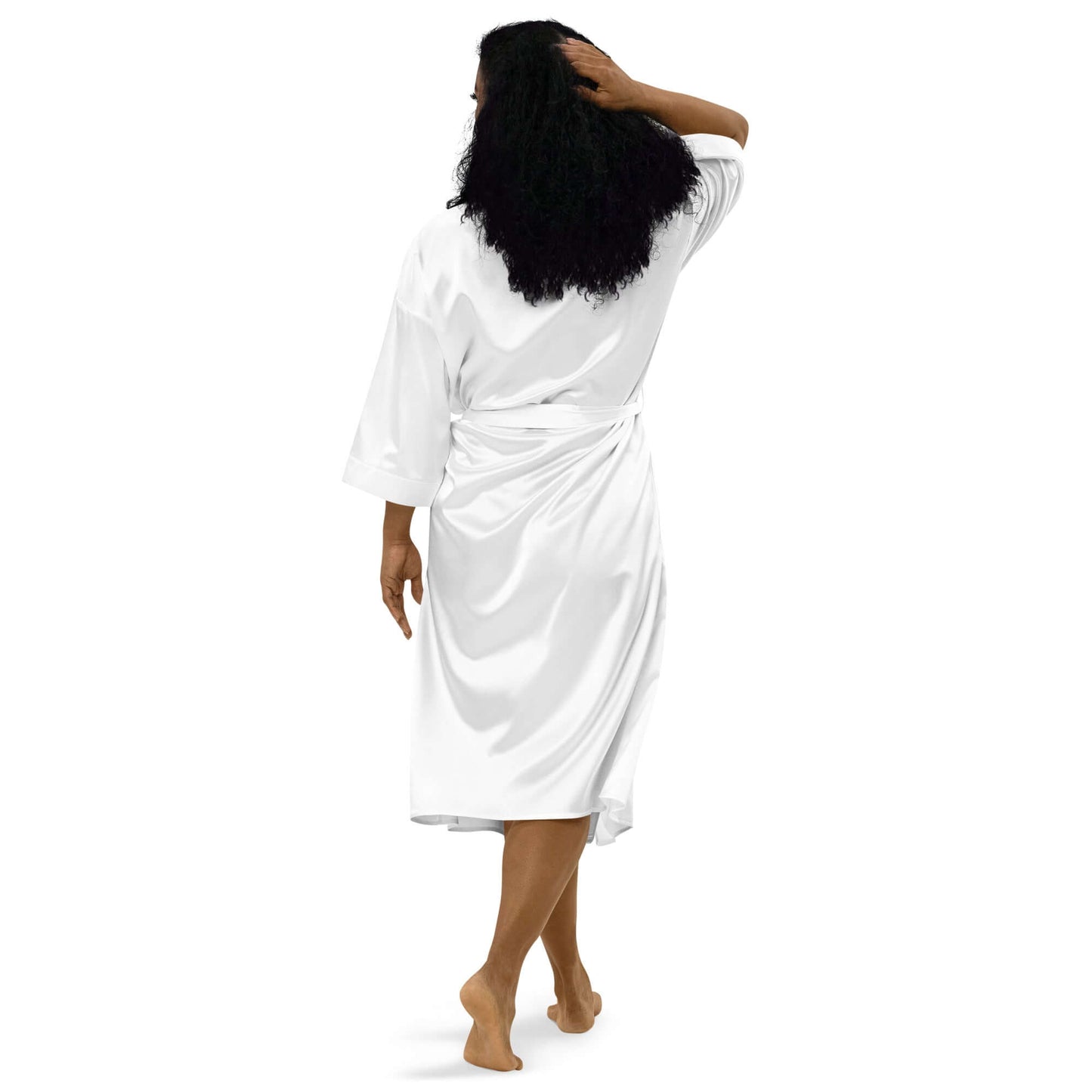 Woman in white Satinmantel N°2 robe, showcasing back view with kimono-style and 3/4 sleeves, perfect for intimate occasions.