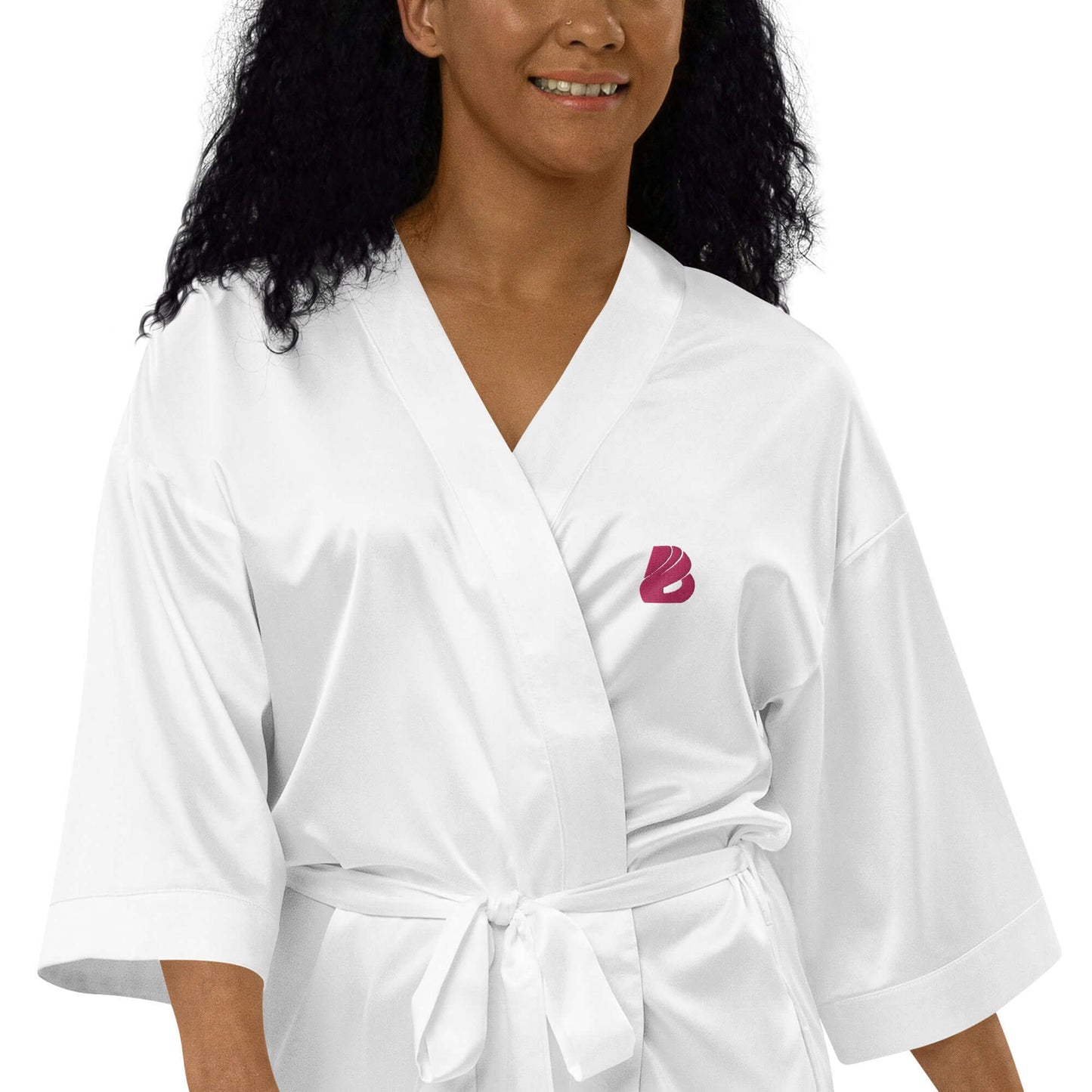 Woman wearing Satinmantel N°2 in white, kimono-style with 3/4 sleeves, ideal for bridal showers and intimate occasions.