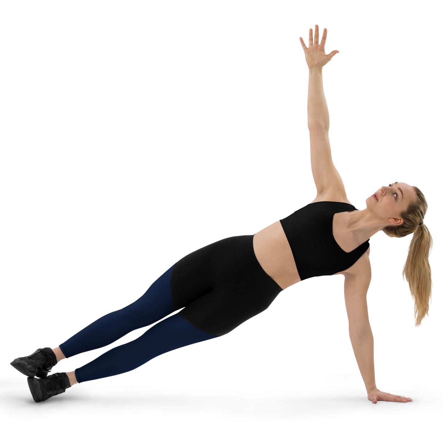 Woman wearing Sport-Leggings N°1 performing a side plank exercise, showcasing flexibility and comfort for active lifestyles.