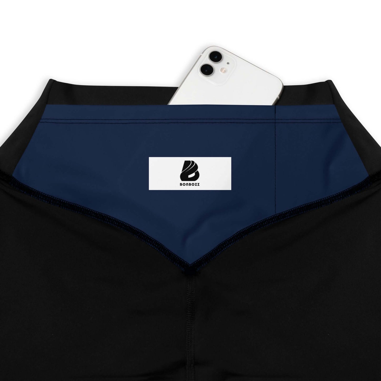 Sport-Leggings N°2 with convenient pocket holding a smartphone, close-up of waistband and logo detail