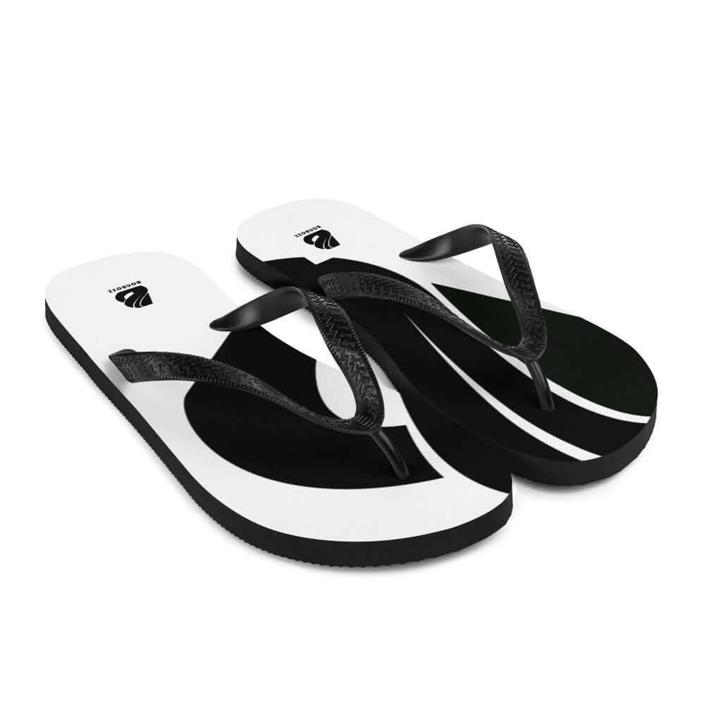 Flip-Flops N°4 featuring black and white design with black Y-shaped rubber straps and rubber soles, perfect for summer adventures.