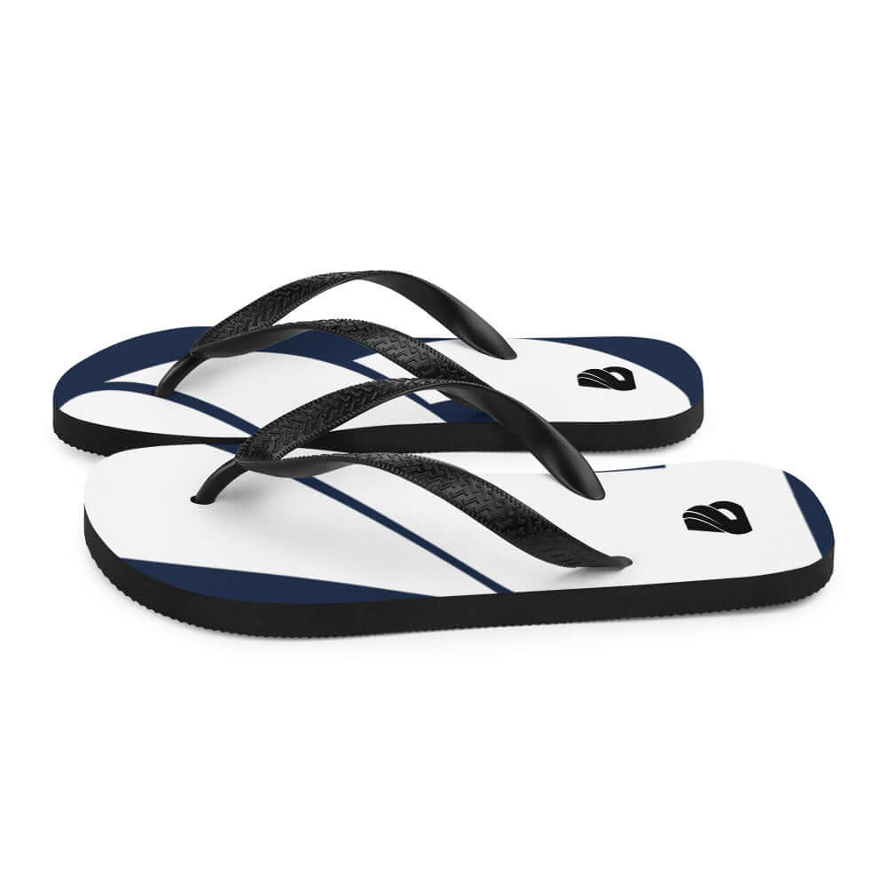Flip-Flops N°1 with black straps and white design, soft fabric overlay on rubber sole, perfect for summer adventures.