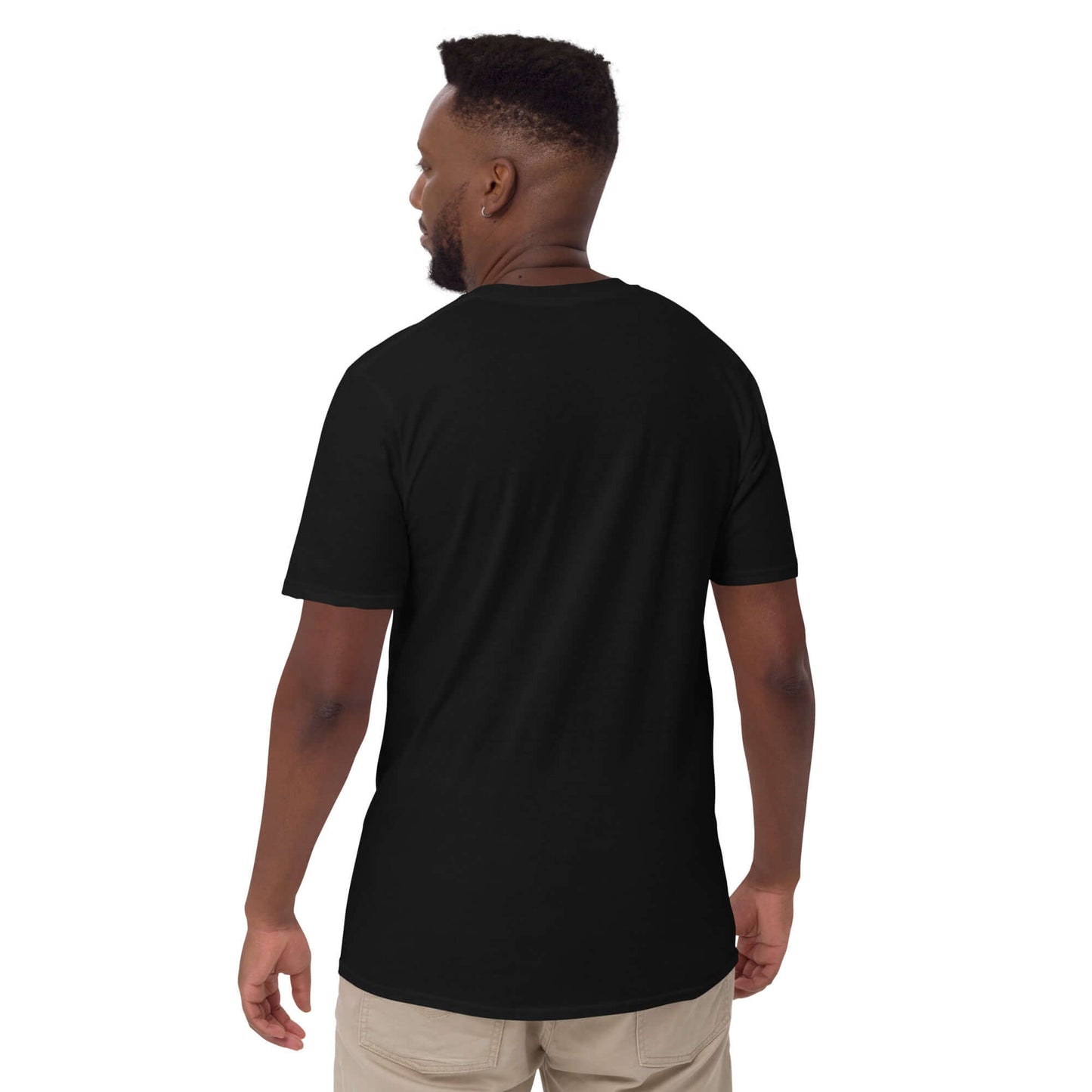 Man wearing a black Kurzärmeliges Unisex-T-Shirt N°6, showing back view, demonstrating comfortable fit and durable double-stitching.