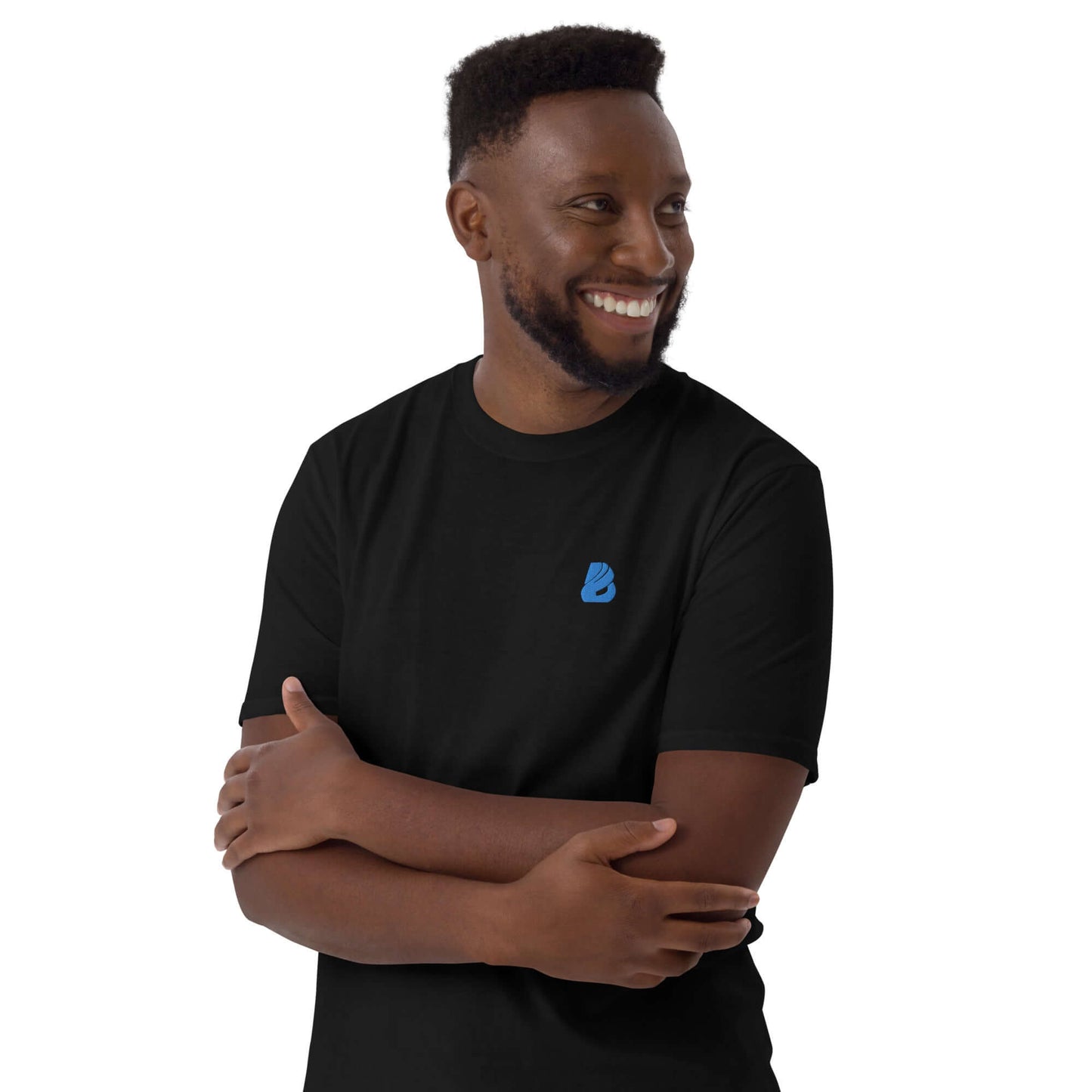 Kurzärmeliges Unisex-T-Shirt N°6 in black being worn by a person, showcasing soft cotton fabric and durability features.