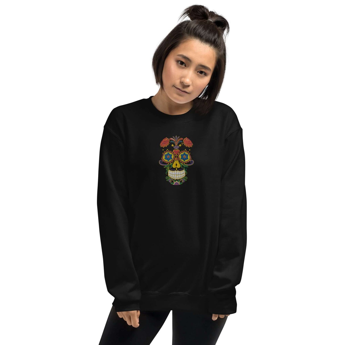 Person wearing Unisex-Pullover N°27 with colorful skull design, featuring durable and warm fabric, ideal for cold months.