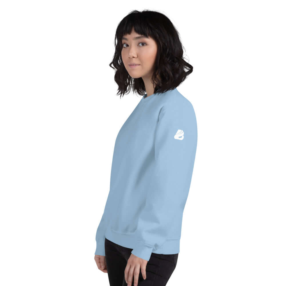 Unisex-Pullover N°5 in light blue, side view of model wearing soft, pre-shrunk pullover with ribbed collar and cuffs for warmth.