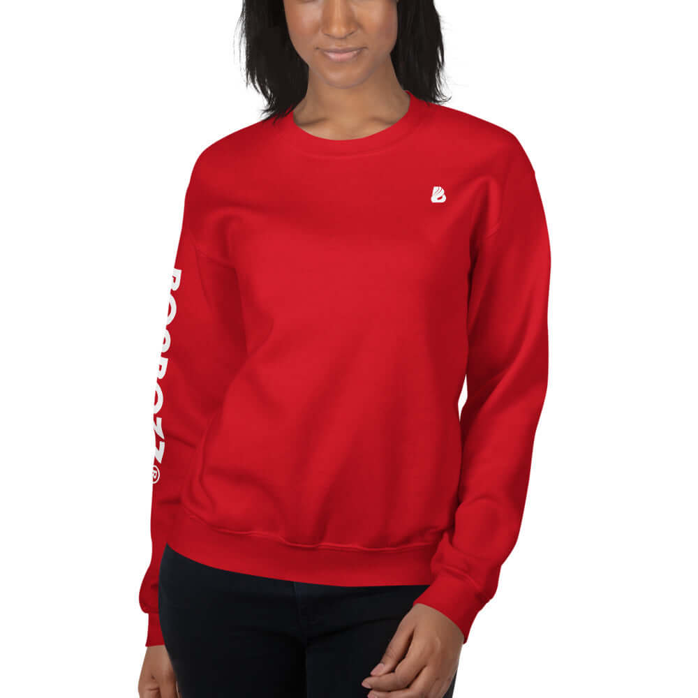 Woman wearing a red Unisex-Pullover N°13, warm and durable with classic cut, made from 50% cotton, 50% polyester blend.