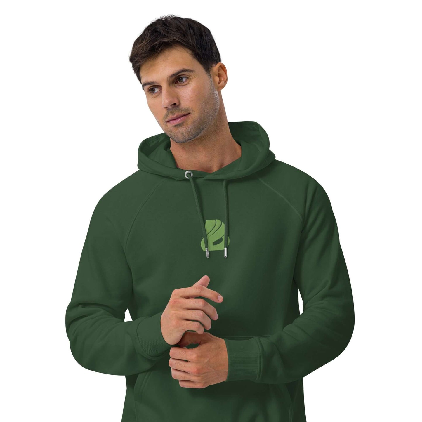 Man wearing green Unisex Bio-Raglan-Hoodie N°2 with logo, showcasing comfortable and stylish casual fashion.