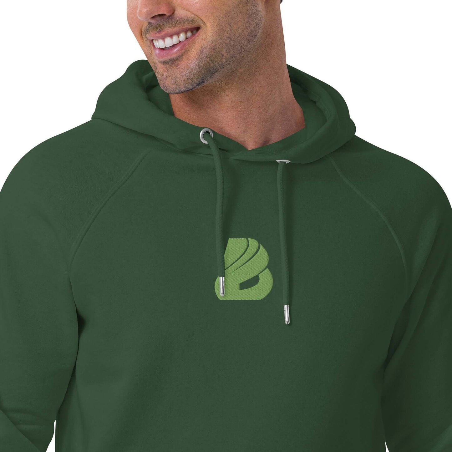 Unisex Bio-Raglan-Hoodie N°2 in dark green with soft interior and stylish logo, perfect for casual or upscale outfits.