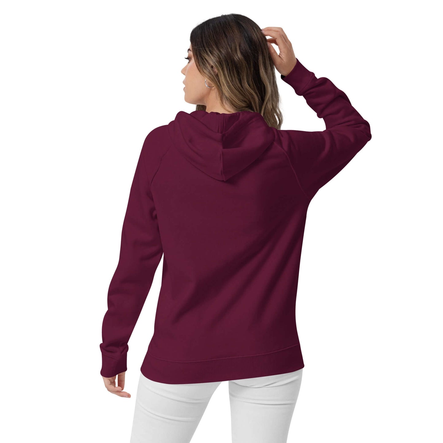 Back view of a person wearing a maroon Unisex Bio-Raglan-Hoodie N°0, showcasing its stylish and comfortable fit.