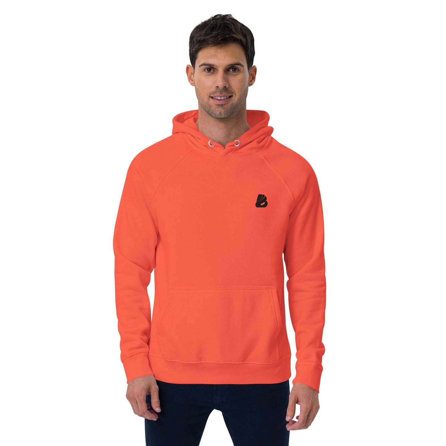 Unisex Bio-Raglan-Hoodie N°1 in coral, worn by model, showcasing comfortable, stylish design with front pocket and adjustable hood.