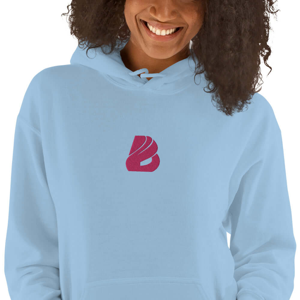 Person wearing Unisex-Kapuzenpullover N°44, soft and stylish hoodie for cool evenings, featuring a double-layered hood and drawstring.