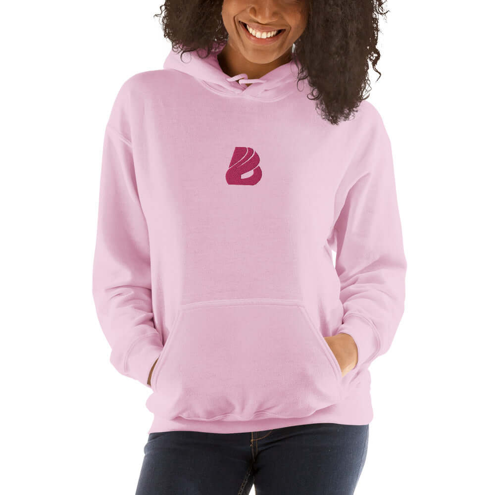 Unisex-Kapuzenpullover N°44 in pink with cozy fit, soft fabric, ideal for cool evenings, features unique logo.