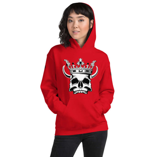 Person wearing red Unisex-Kapuzenpullover N°1 with skull and crown design, perfect for cozy evenings, blend of cotton and polyester.
