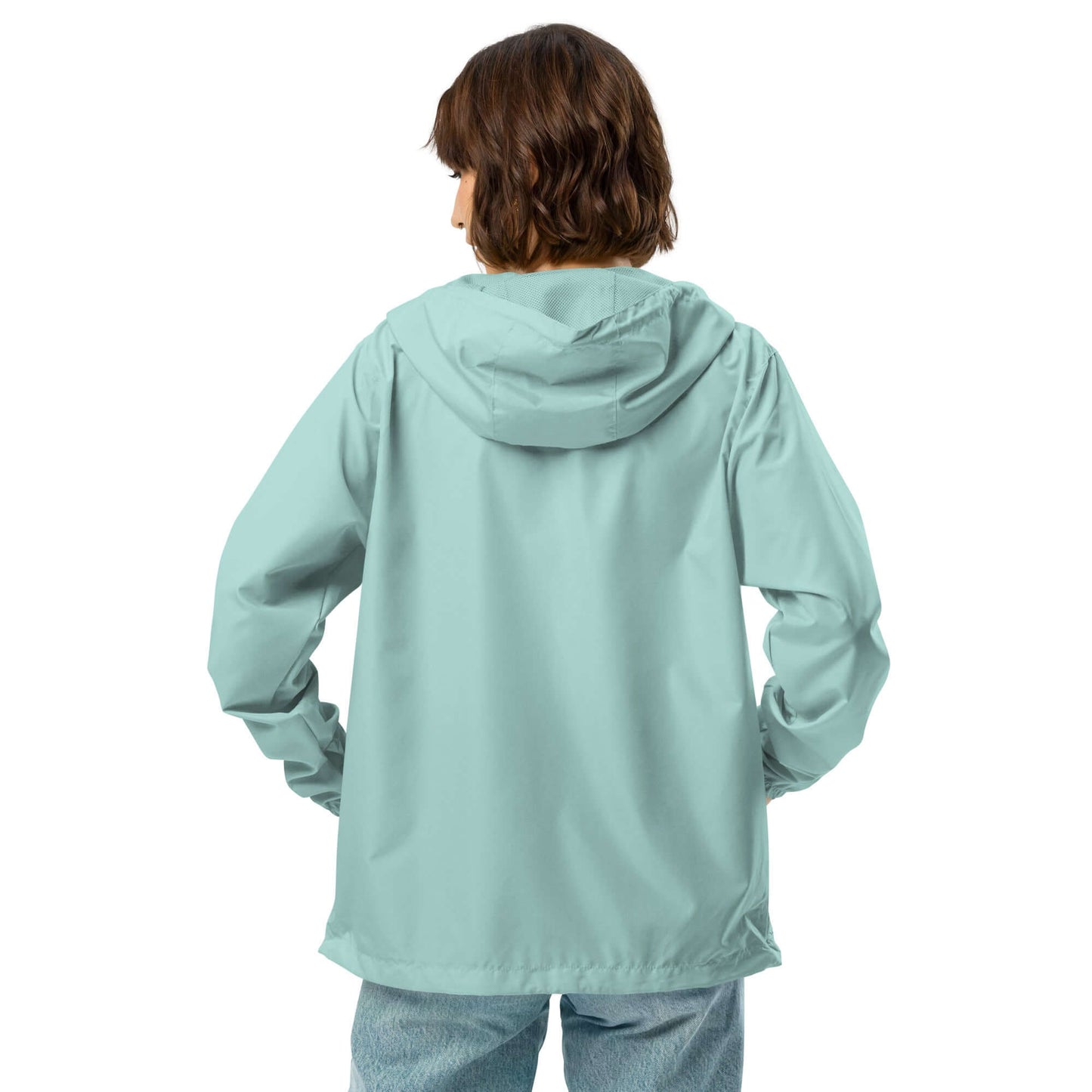 Person wearing Leichter Unisex-Windbreaker mit Reißverschluss N°0, light blue, perfect for outdoor adventure, waterproof, lightweight