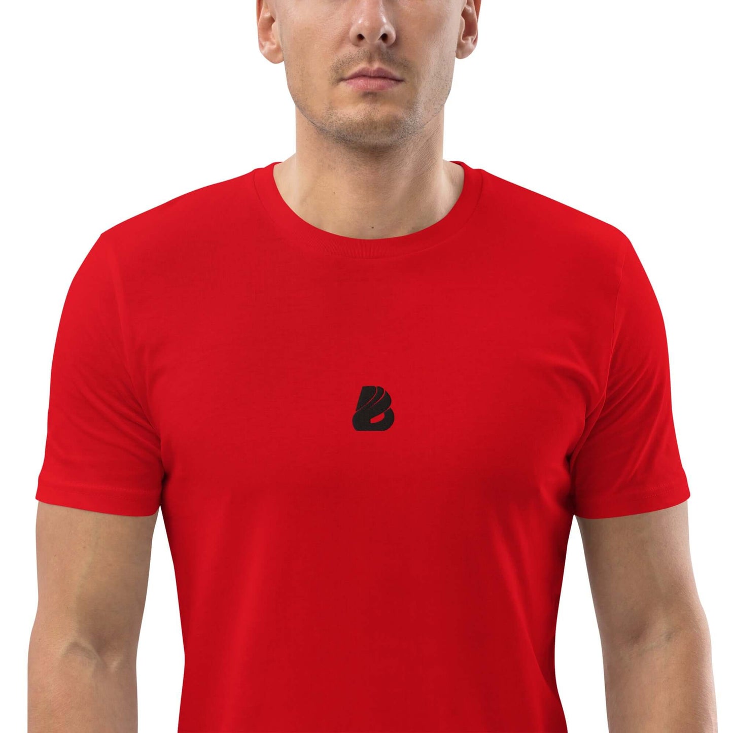 Person wearing Unisex-Bio-Baumwoll-T-Shirt N°0 in vibrant red color, made from 100% organic cotton for a sustainable fashion choice.
