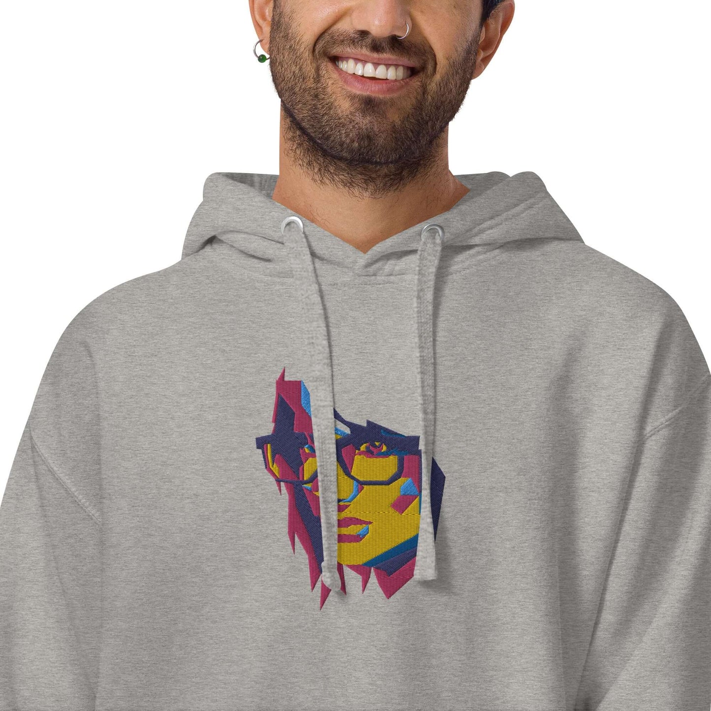 Unisex-Kapuzenpullover N°39 with colorful face design, featuring kangaroo pocket, flat drawstrings, perfect for cool evenings.