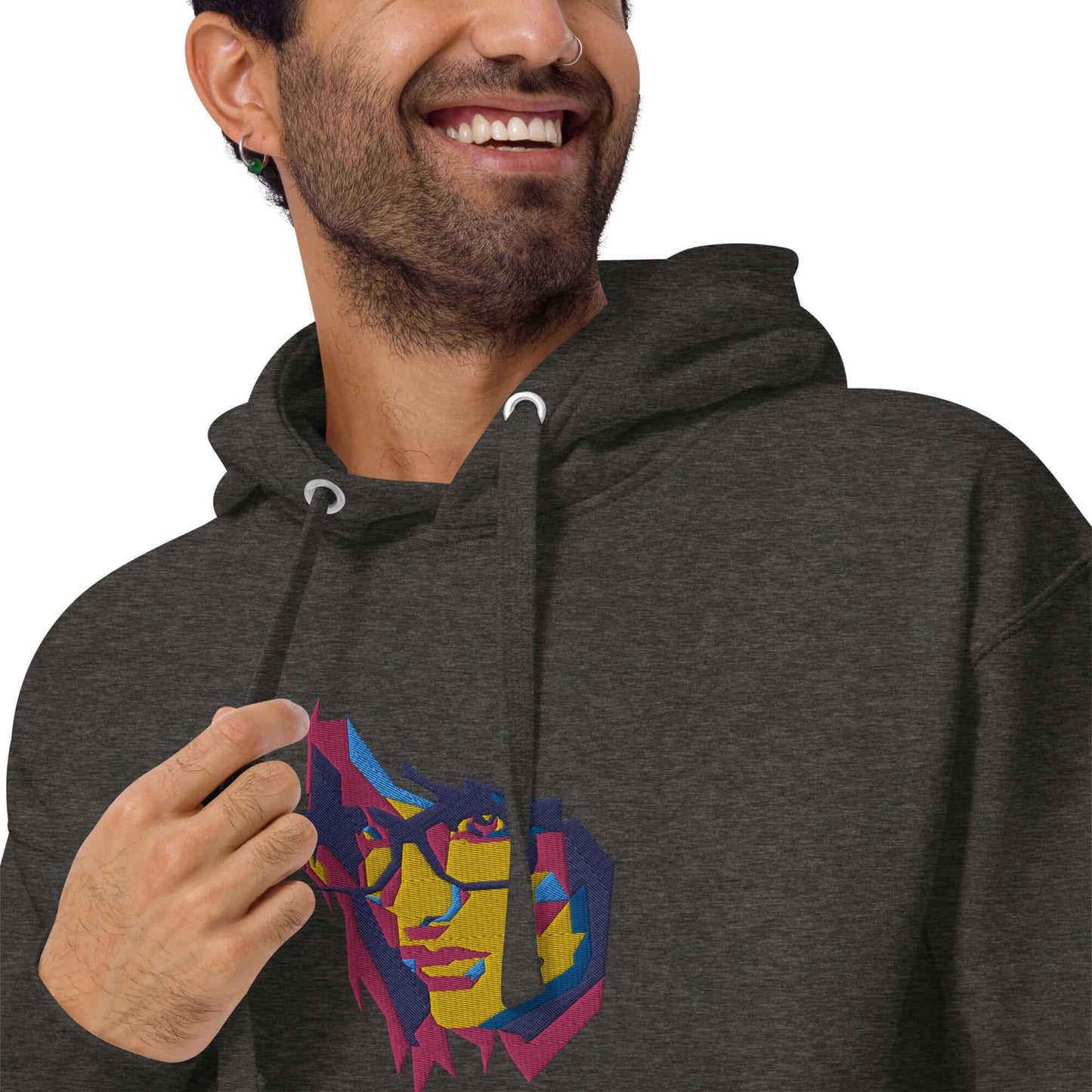 Man wearing Unisex-Kapuzenpullover N°39 with vibrant graphic design, featuring kangaroo pocket and warm hood for cool evenings.