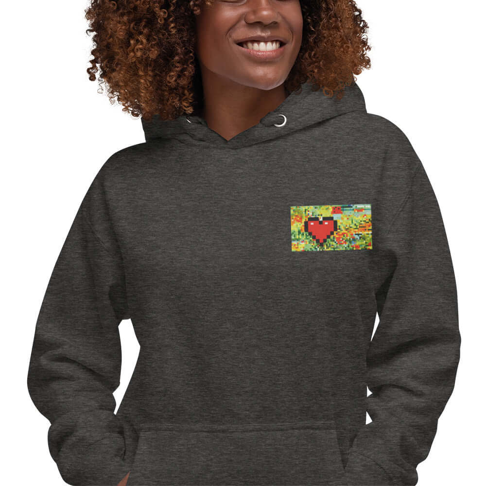 Unisex-Kapuzenpullover N°45 with heart design, soft and stylish, featuring a kangaroo pocket and warm hood on smiling model.