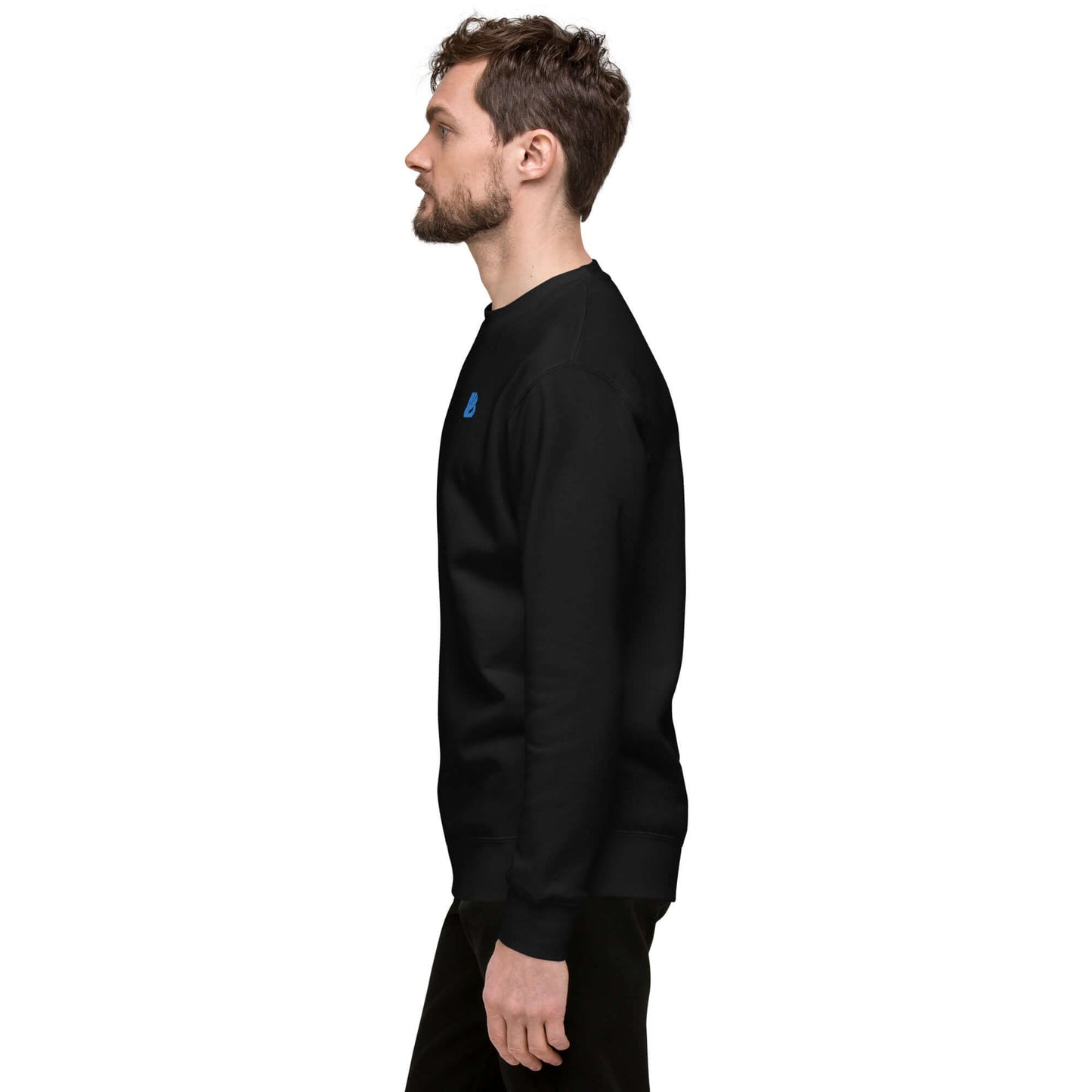 Man wearing Unisex-Premium-Pullover N°0, black color, side view, showing ribbed crew neckline and long sleeves, ideal for streetwear.