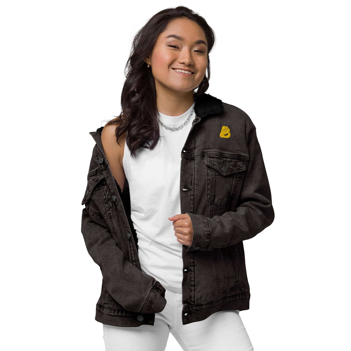 Person wearing Unisex Sherpa Jeansjacke N°0, black denim jacket with sherpa lining, stylish and eco-friendly fashion.