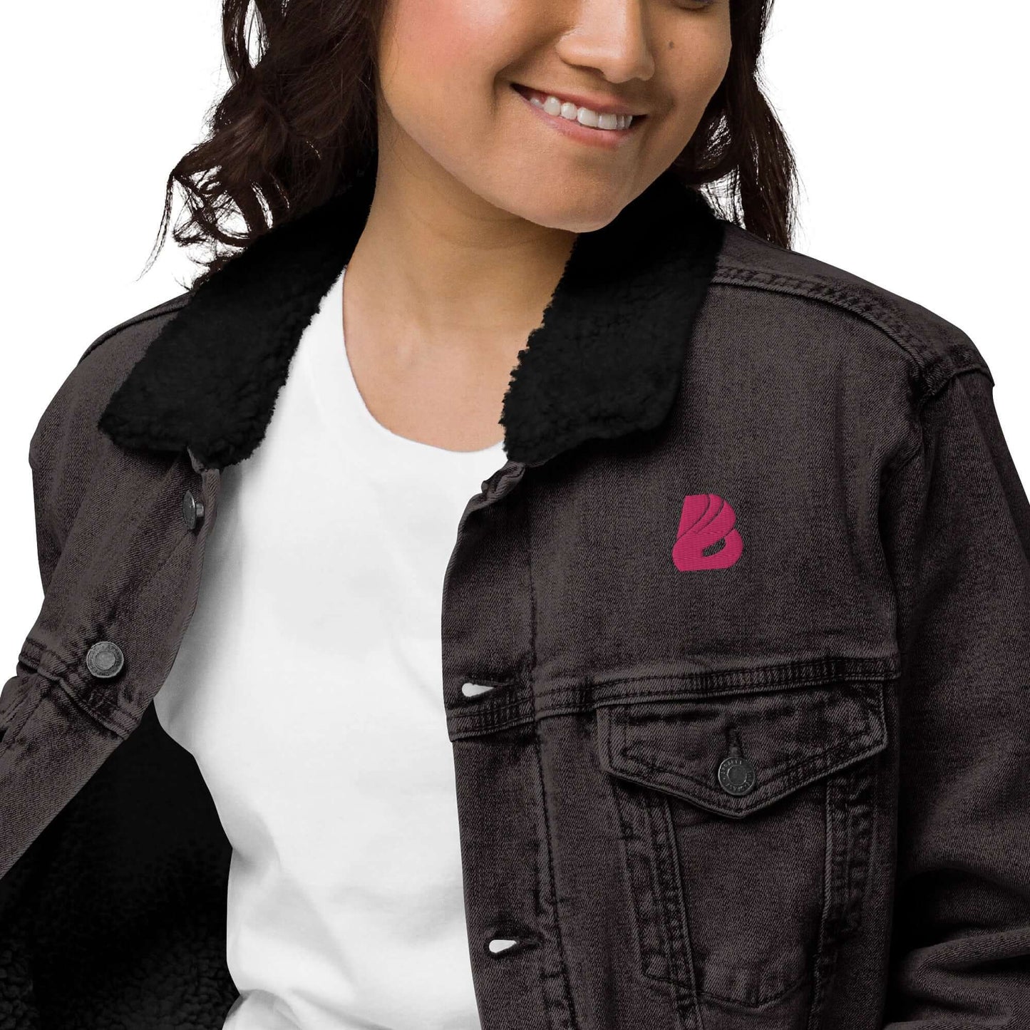 Person wearing Unisex Sherpa Jeansjacke N°1 with sherpa lining, eco-friendly recycled interior, and stylish black denim.