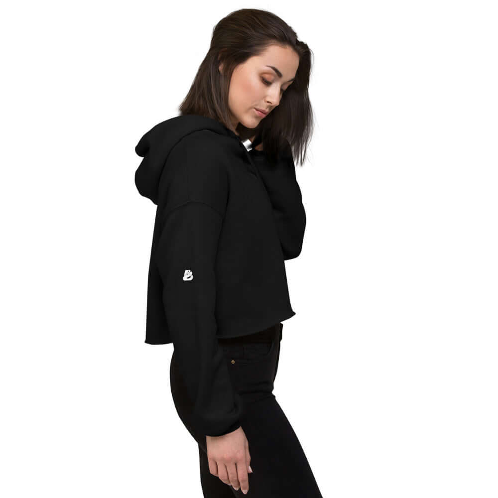Woman wearing black Crop-Hoodie N°0 with raw hem and matching drawstring, side view