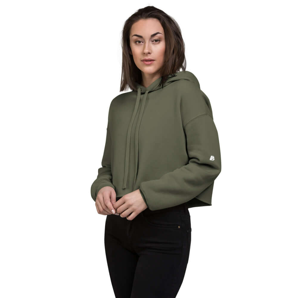 Woman wearing green Crop-Hoodie N°0 with raw hem and matching drawstring, featuring a stylish design. Perfect for modern wardrobes.