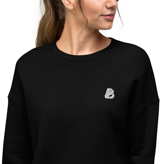 Crop-Pullover N°0 in black with ribbed neckline and raw hem, showcasing soft fleece material for fashion and comfort.
