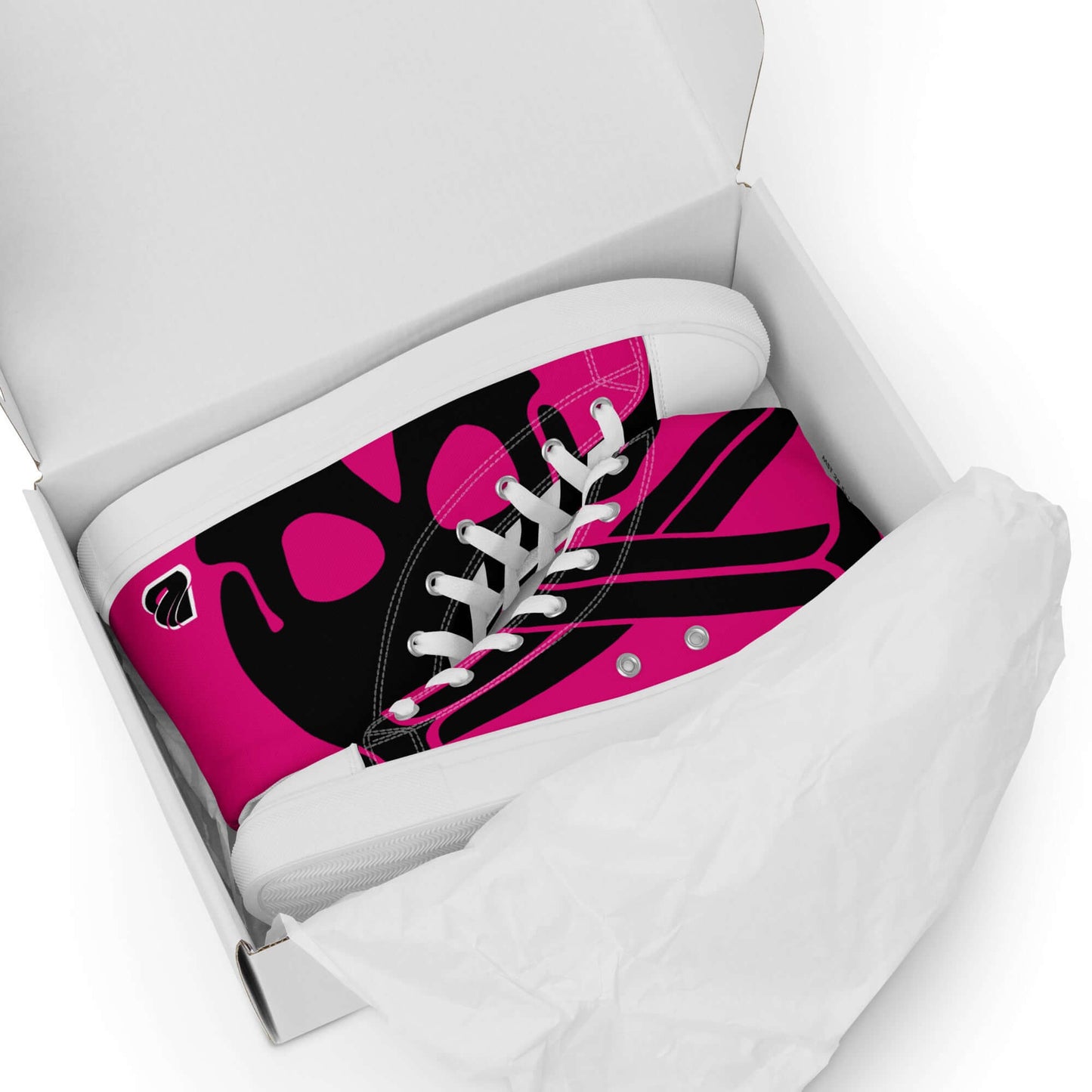 High-top sneakers in pink and black pattern, packaged in a box with tissue paper.