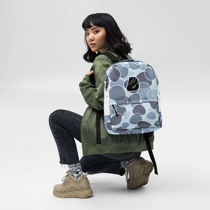 Woman wearing Rucksack N°5, blue and gray pattern, suitable for daily use and sports, featuring water-resistant fabric and spacious pockets.